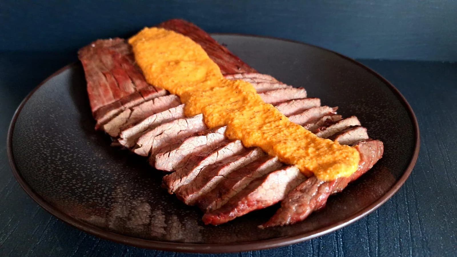 Flank steak with romesco sauce