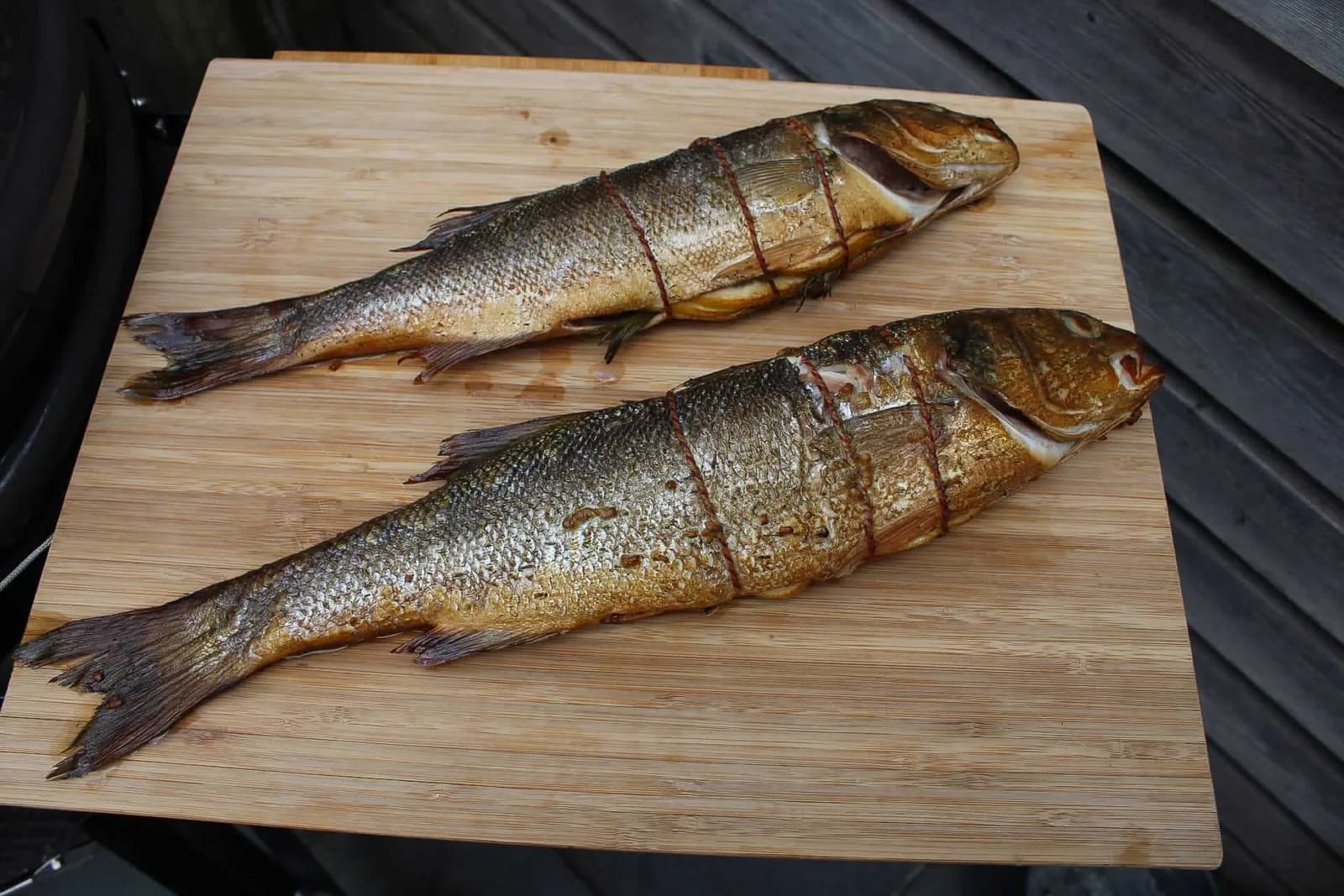 Hot-smoked sea bass with herb oil